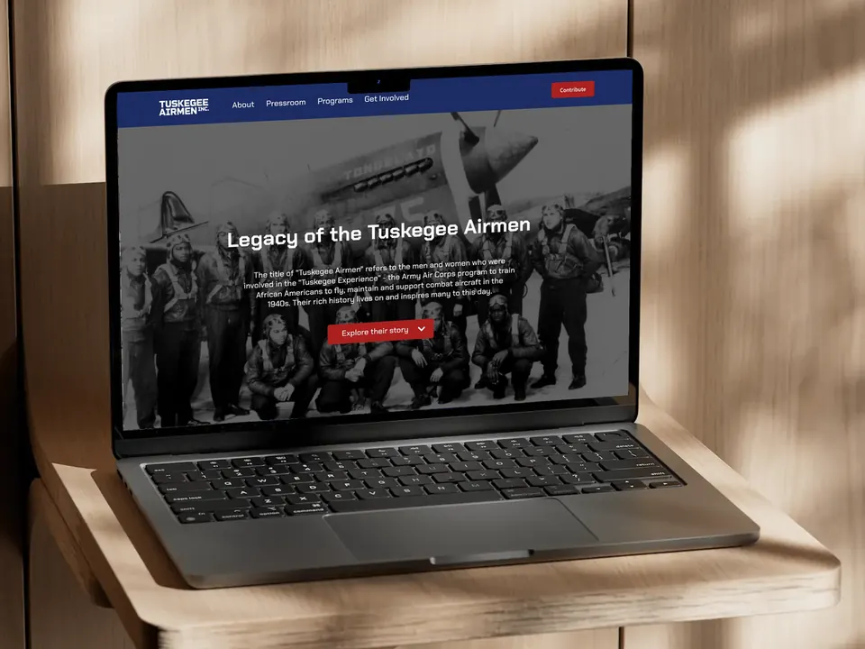 Redesigned Tuskegee Airmen Inc. website on a laptop
